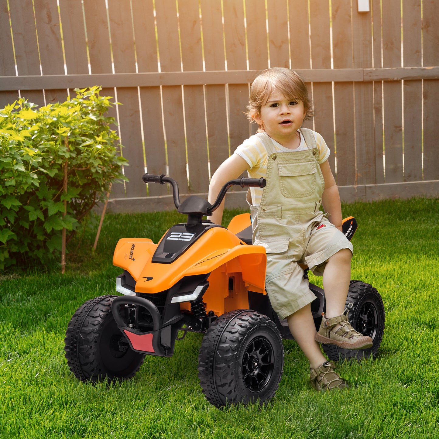 HOMCOM Mclaren Licensed 12V Quad Bike with Slow Start, Music, Headlights, MP3 Slot, Suspension Wheels, for 3-8 Years - Orange