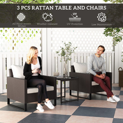 Outsunny 3 Pieces Rattan Bistro Set with 4 Cushions, Wicker Garden Furniture Set, Glass Top Coffee Table and Chairs for Outdoor Patio, Balcony, Terrace and Conservatory, Brown